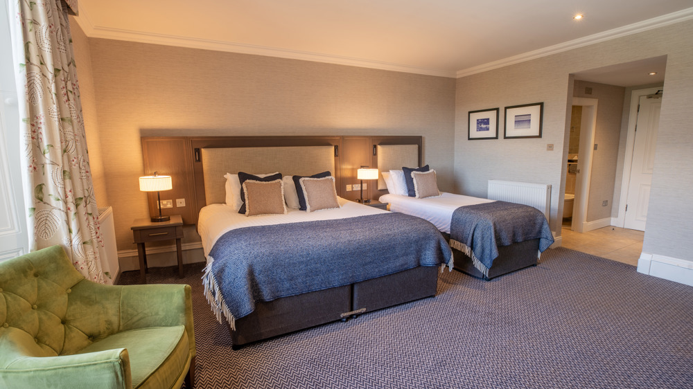 Feature Family Room with a king-sized bed and single bed.