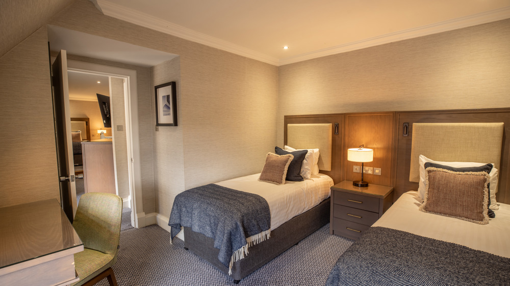 Family apartment with two single beds in their own sleeping area.