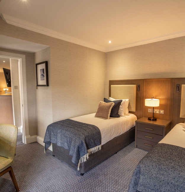 Family apartment with two single beds in their own sleeping area.